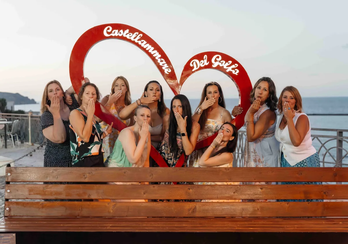 The group posing behind the red Castellammare del Golfo heart sculpture