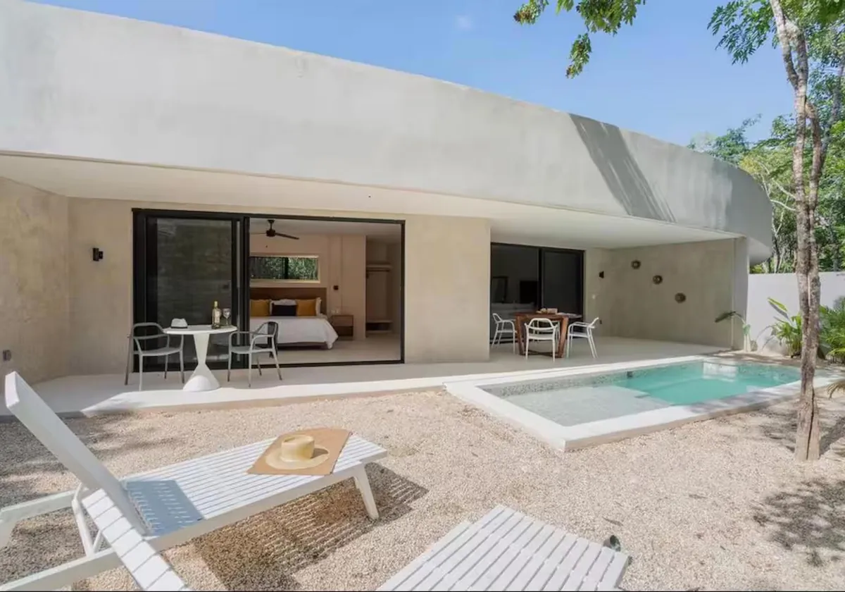 A Garden Pool Suite patio with loungers beside its private plunge pool