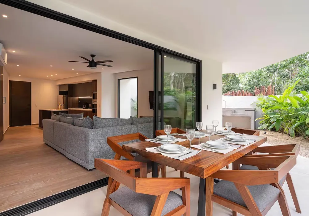A suite kitchen and dining table set for dinner