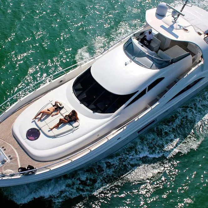 A private yacht cutting through turquoise Caribbean water
